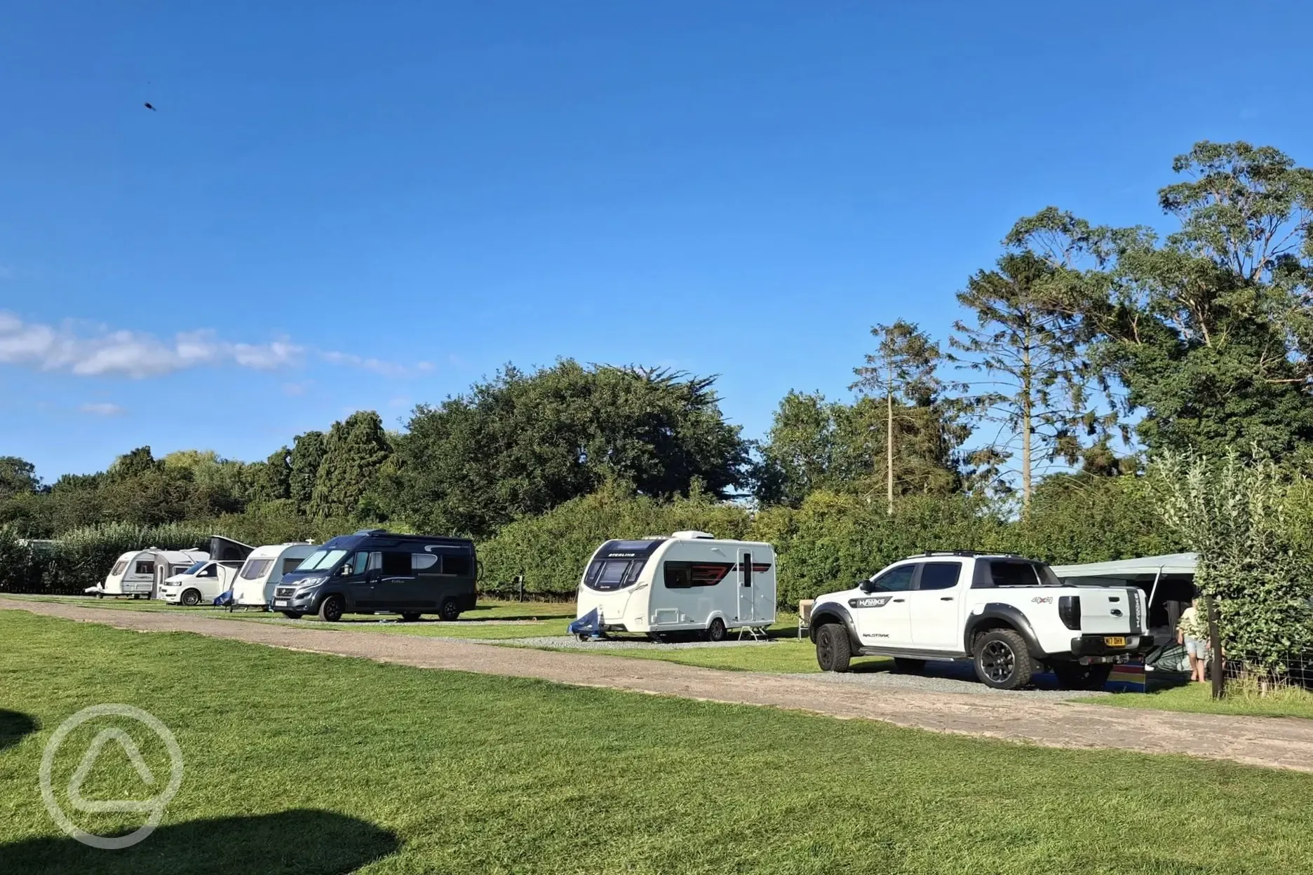 Electric hardstanding and grass touring pitches
