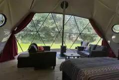 Glamping dome lounge area and wood burner