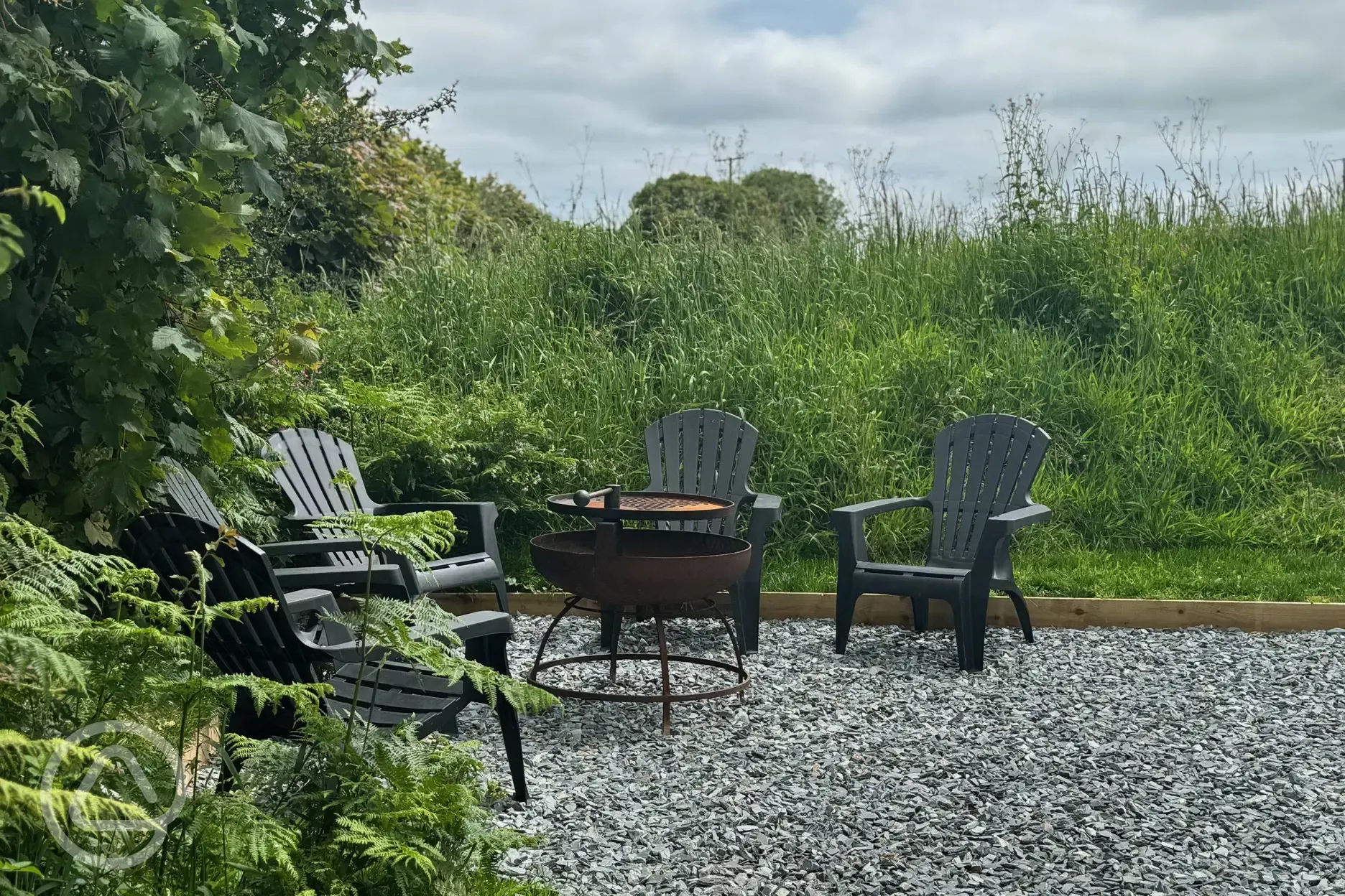 Glamping dome seating and BBQ fire pit