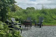 Glamping dome seating and BBQ fire pit