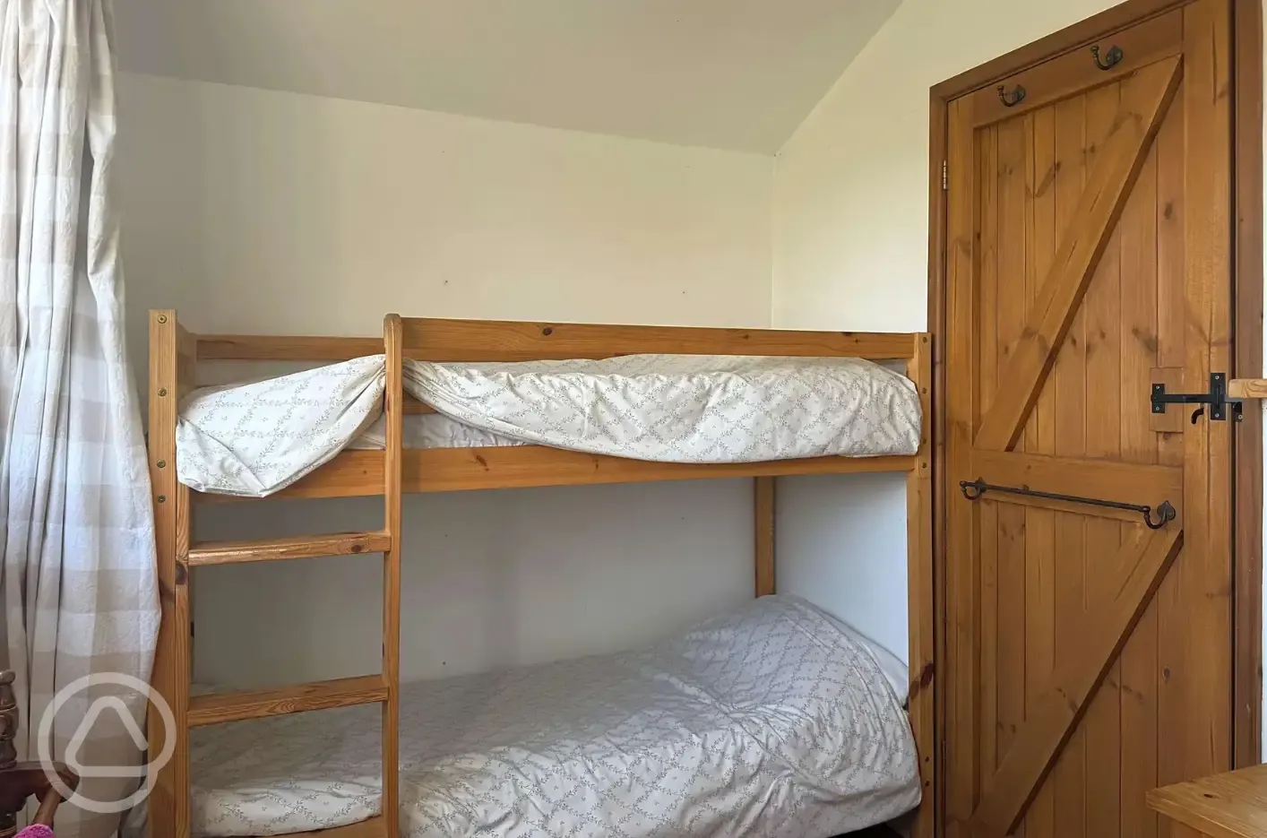 Log glamping cabin bunk bed