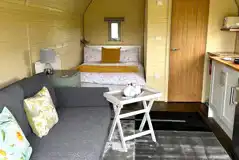 Adult only glamping pod with hot tub interior with double bed, ensuite and sofa Adult only glamping pod with hot tub interior with double bed, ensuite and sofa