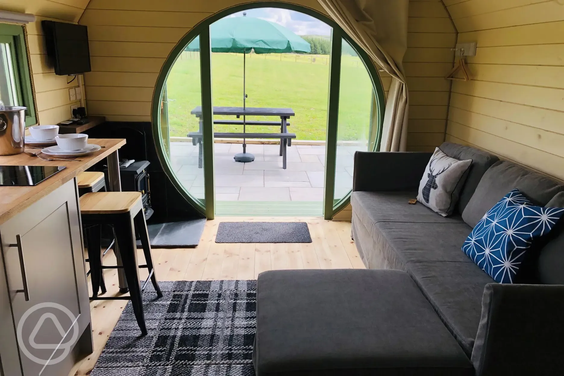 Standard glamping pod kitchenette and sofa bed