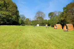Grass pitches and camping pods Grass pitches and camping pods