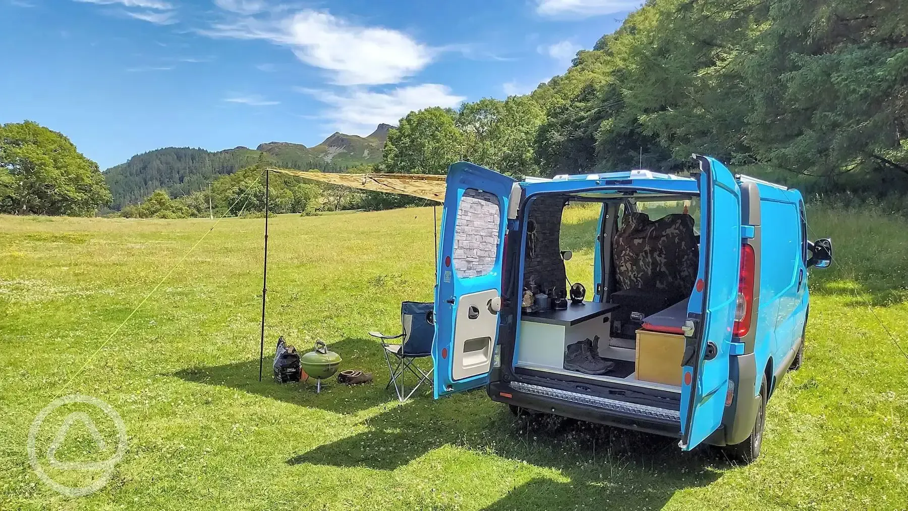 Small campervan on a non electric grass pitch at Cefn Coed