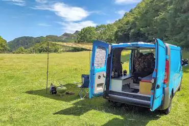 Small campervan on a non electric grass pitch at Cefn Coed
