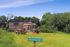 Bramble yurt complete with an outdoor kitchen and picnic table