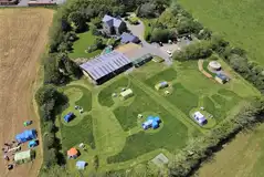 Aerial of the non electric and electric grass pitches at Quarry Park Camping