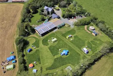 Aerial of the non electric and electric grass pitches at Quarry Park Camping