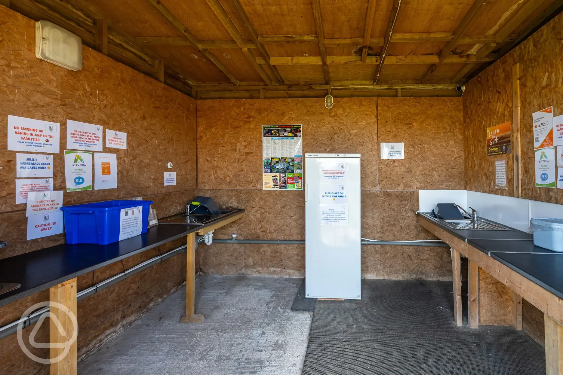 Covered washing up area with a freezer for ice blocks