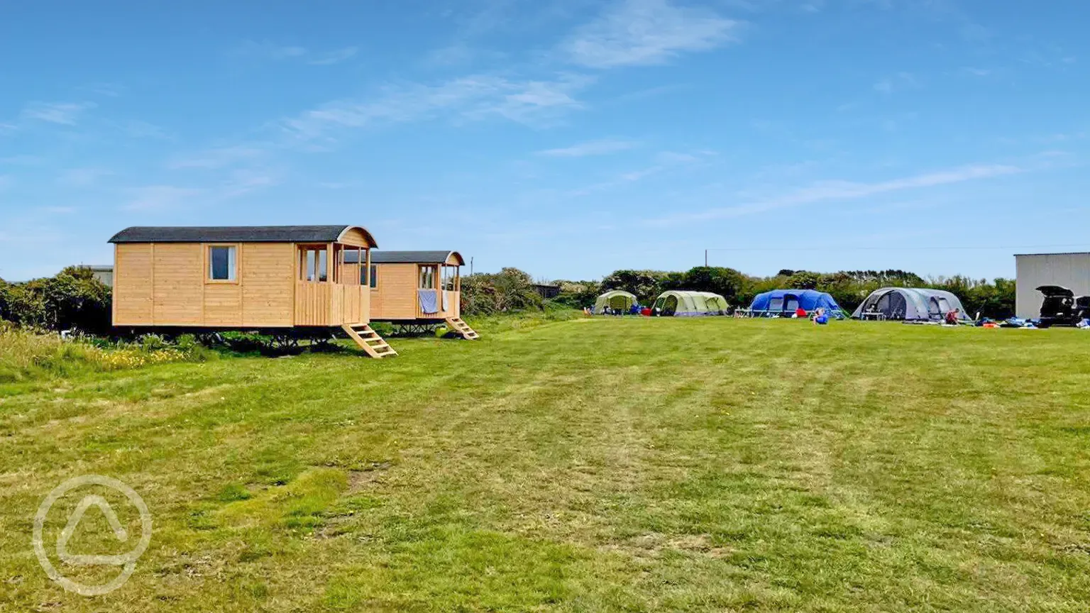 Shepherd's huts and grass pitches
