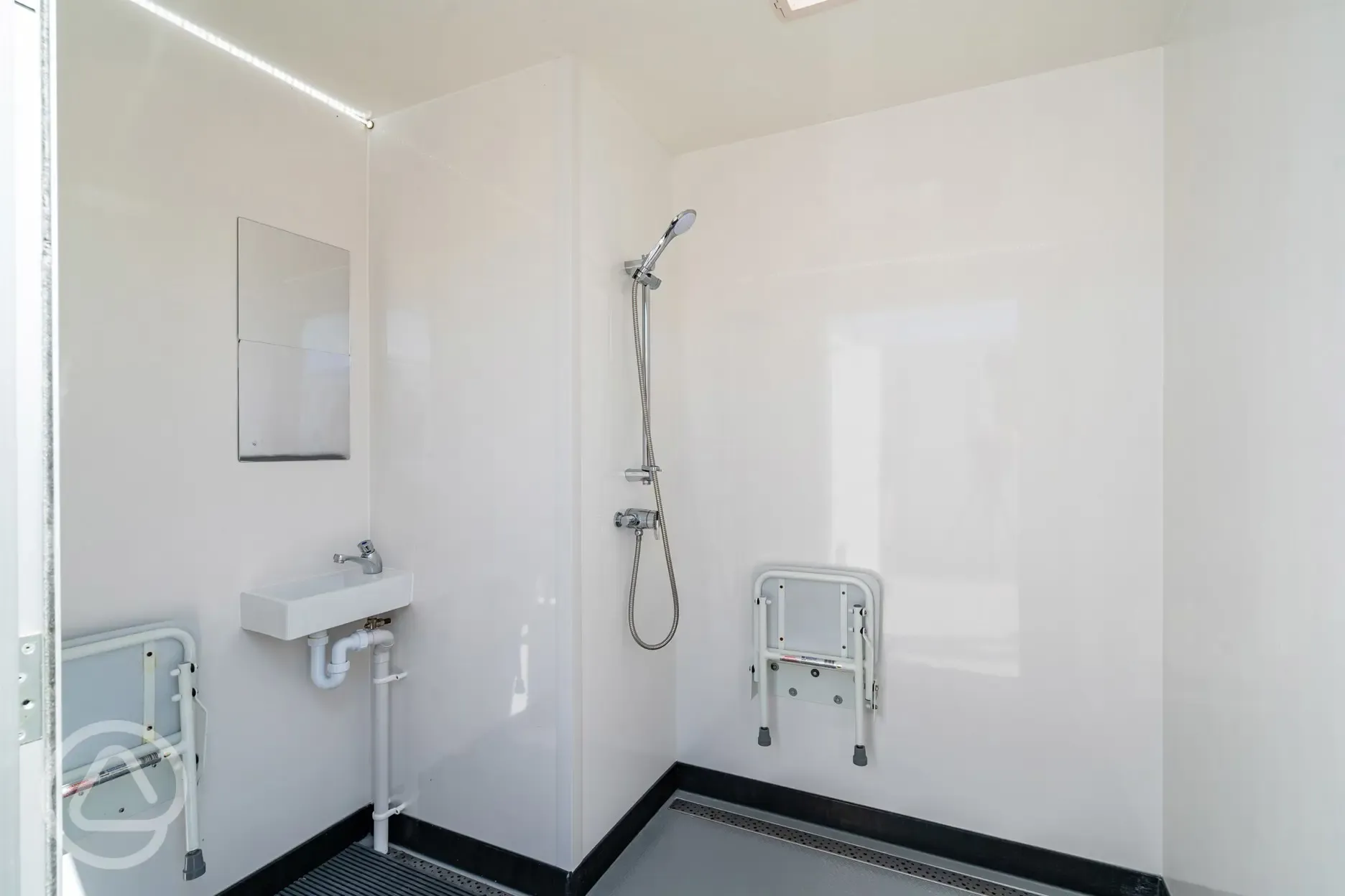 Accessible bathroom with a fold down shower chair