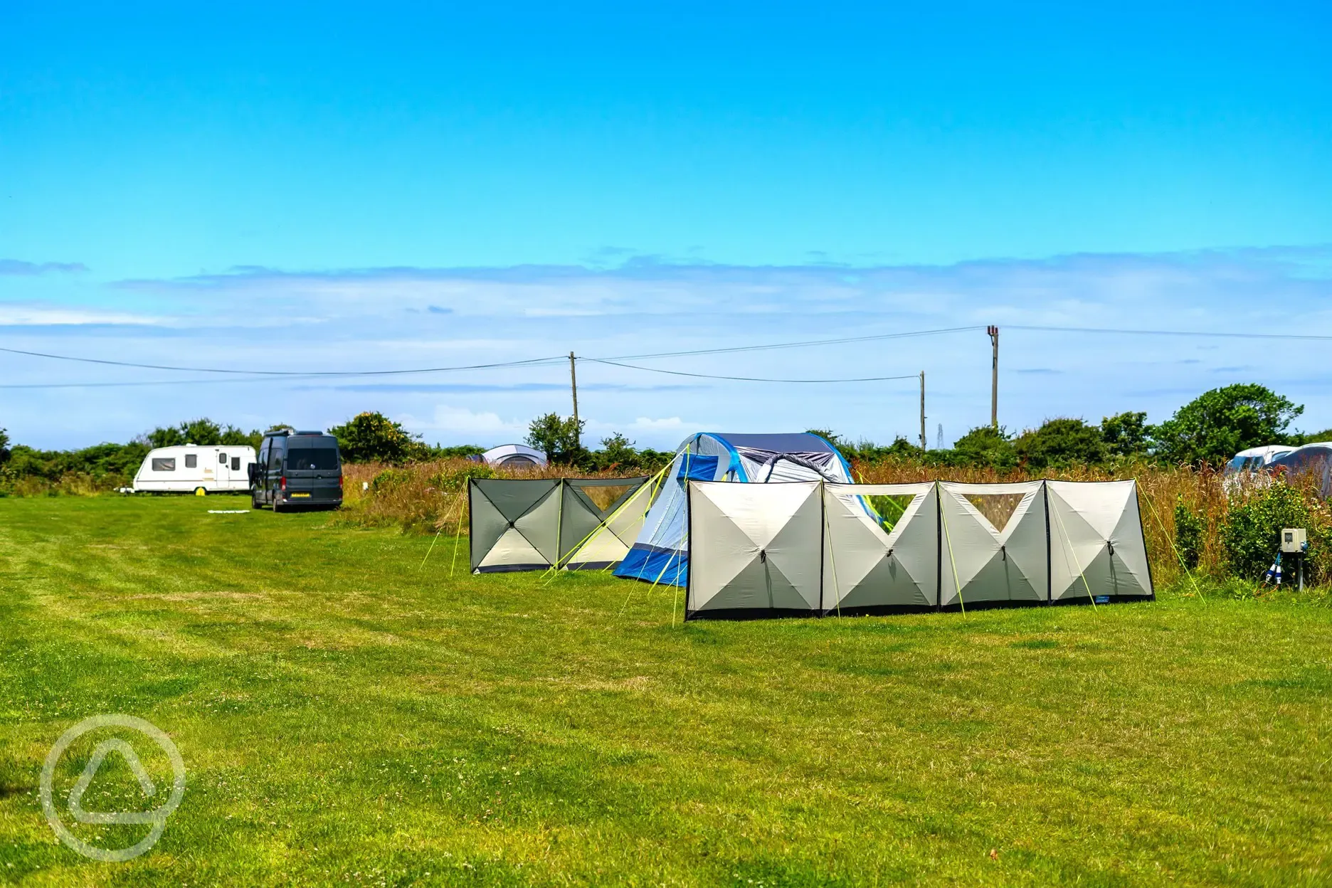 Electric grass pitches with windbreakers pitched