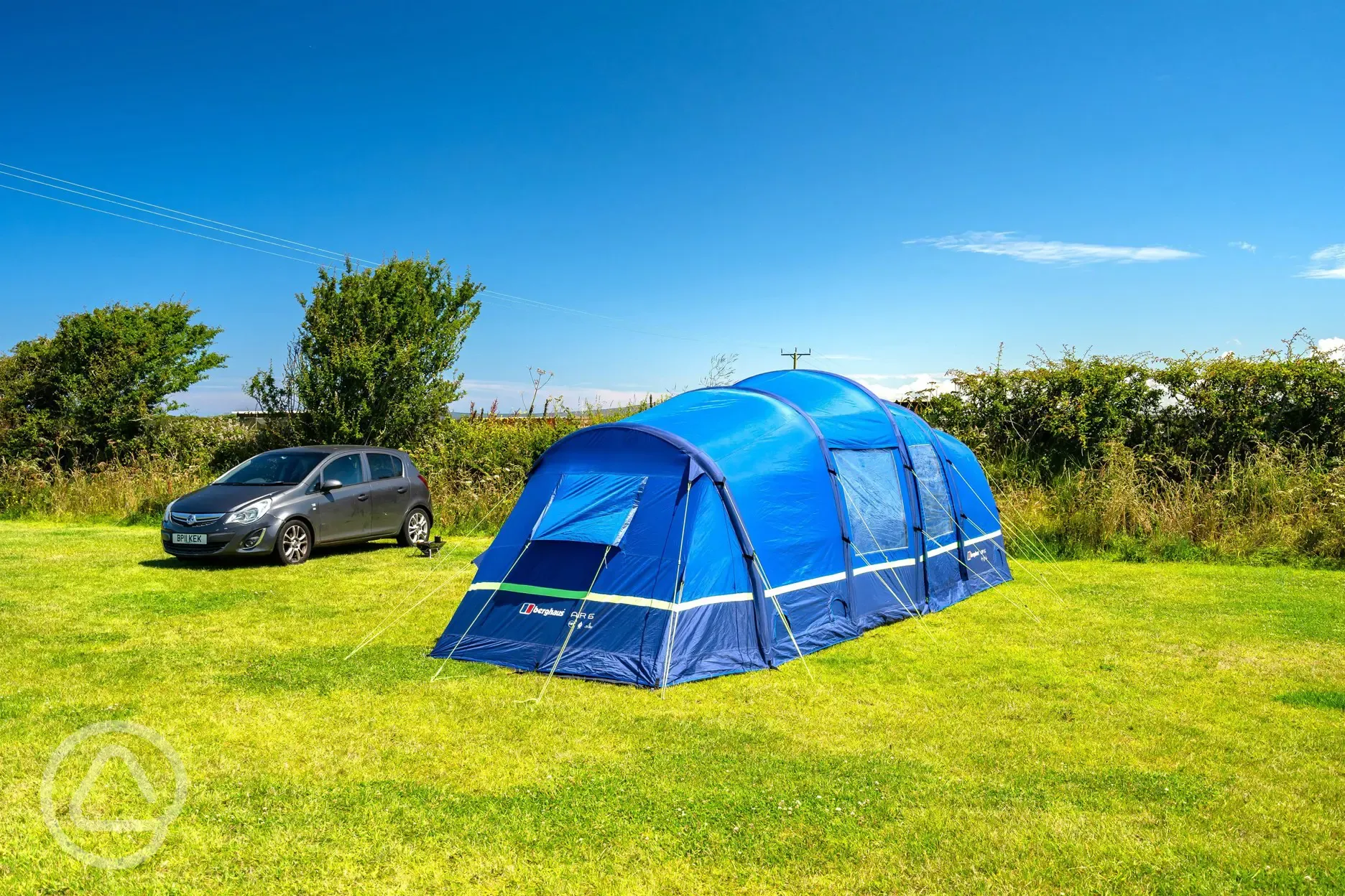 Non electric grass pitches backed by a hedge