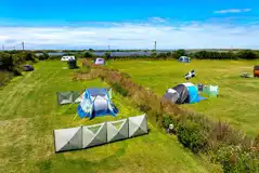 Raised view of the electric grass pitches with hedging between rows Raised view of the electric grass pitches with hedging between rows
