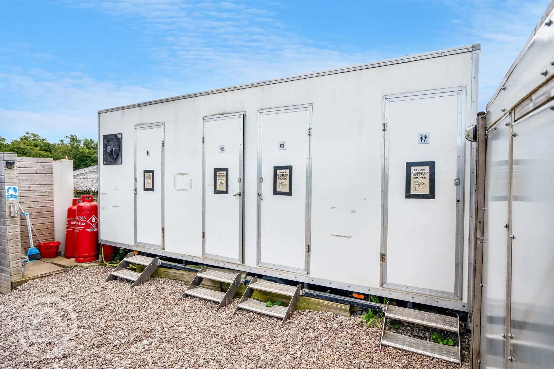 Shower block exterior, please note a coin is needed to operate the showers