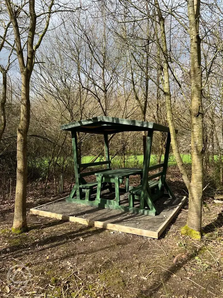 Seating area by the non electric woodland tent pitches