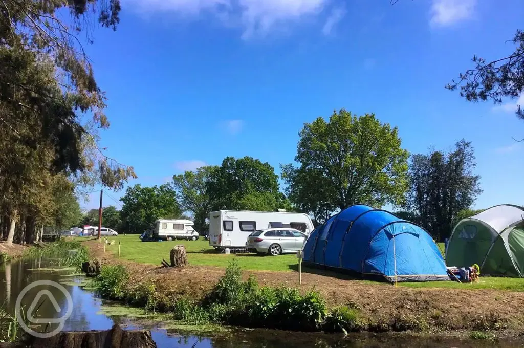 camping pitches by the river