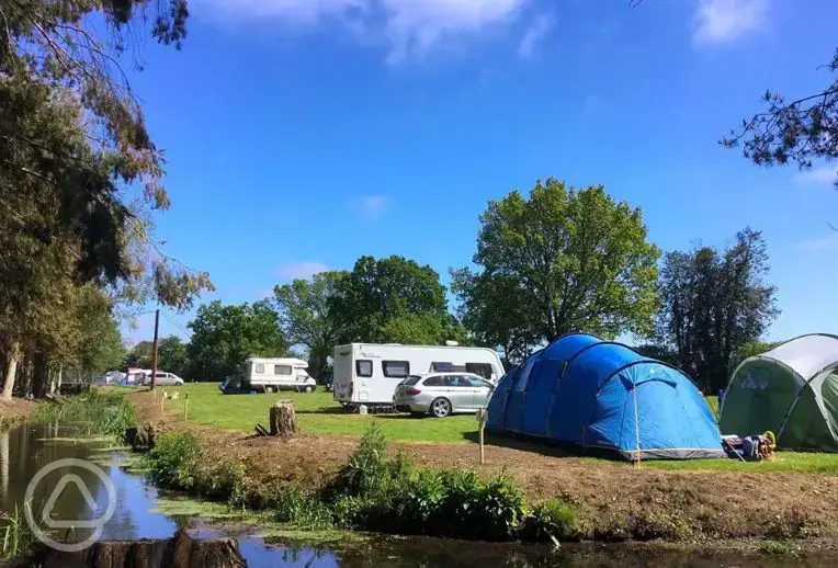 camping pitches by the river