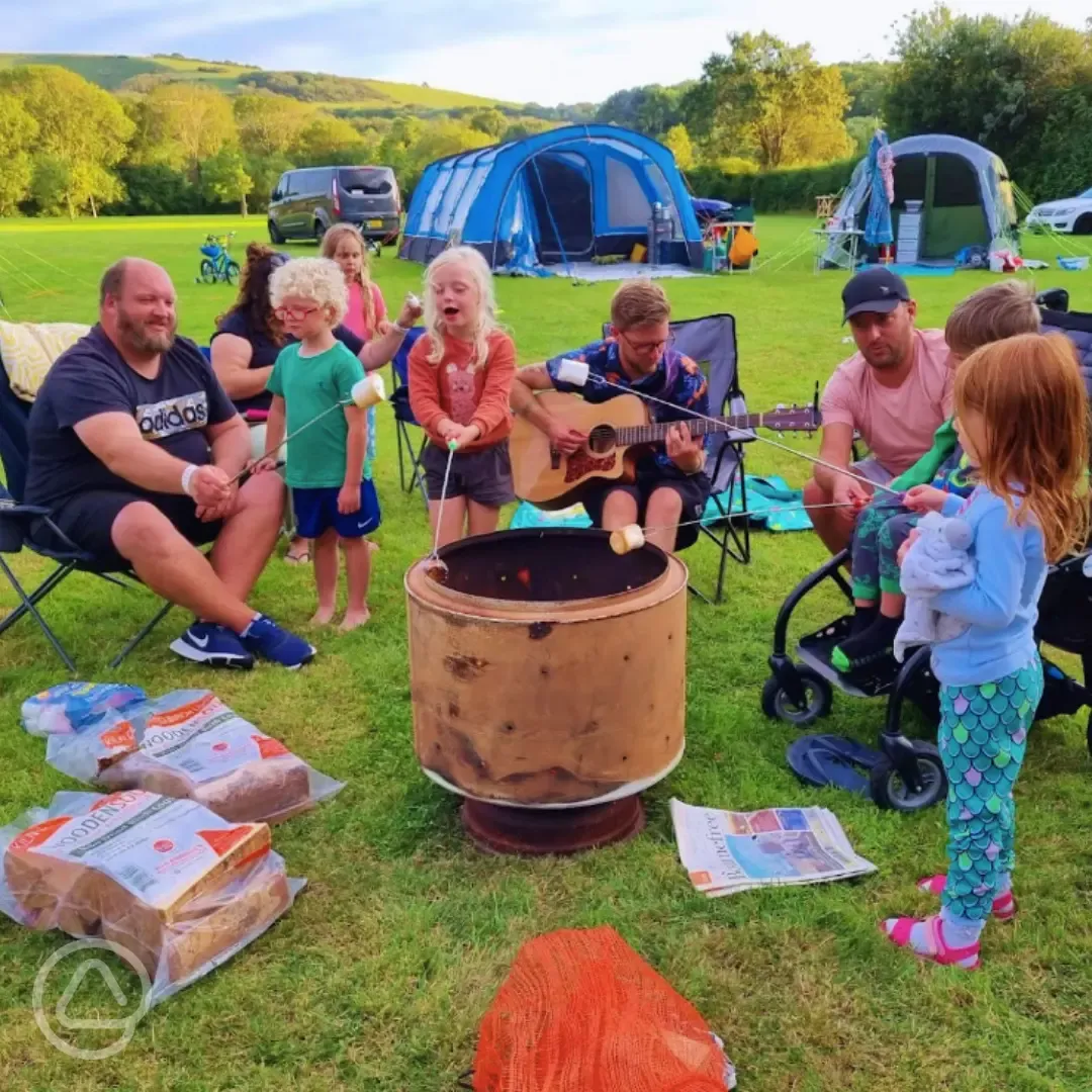 Family friendly around fire pit at Bramley Park Camping