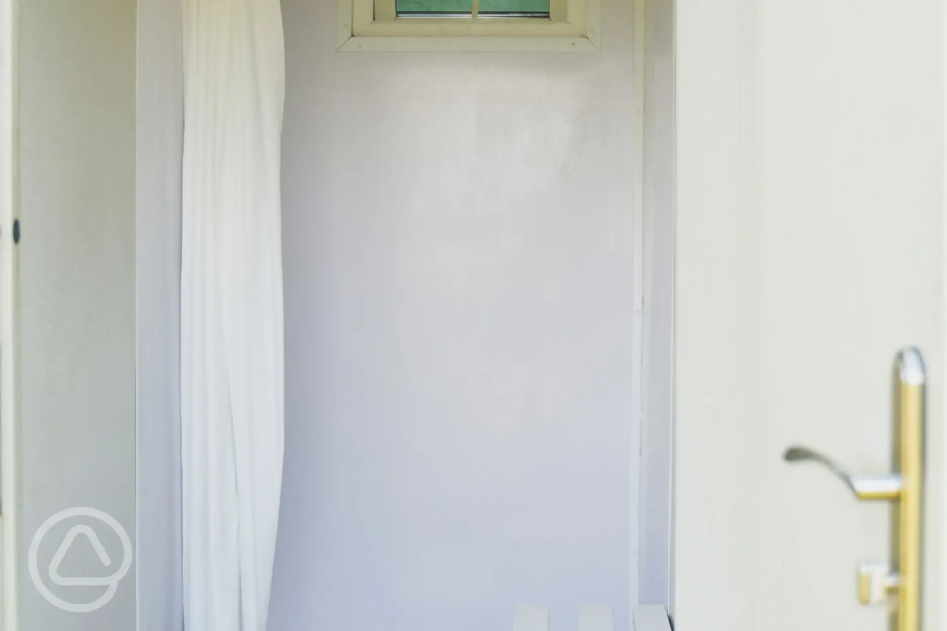 Showers with a curtain and bench