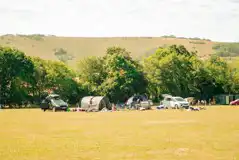 Non electric grass pitches with parking spaces beside tents Non electric grass pitches with parking spaces beside tents