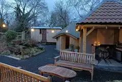 The Fisherman's hut by communal BBQ and kitchen at night