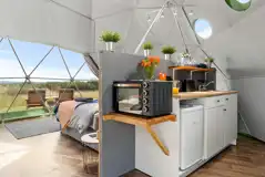 Orion geodome interior with kitchen area and microwave