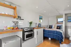 Thrift shepherd's hut interior (pet friendly) with double bed and kitchenette