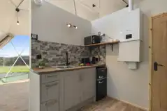 Aries geodome kitchen with sink, fridge, freezer, kettle, toaster and microwave
