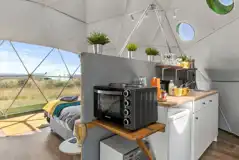 Taurus geodome interior with kitchen area and microwave 
