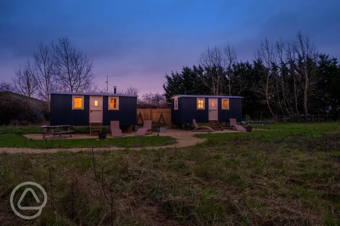 Shepherd's huts at night