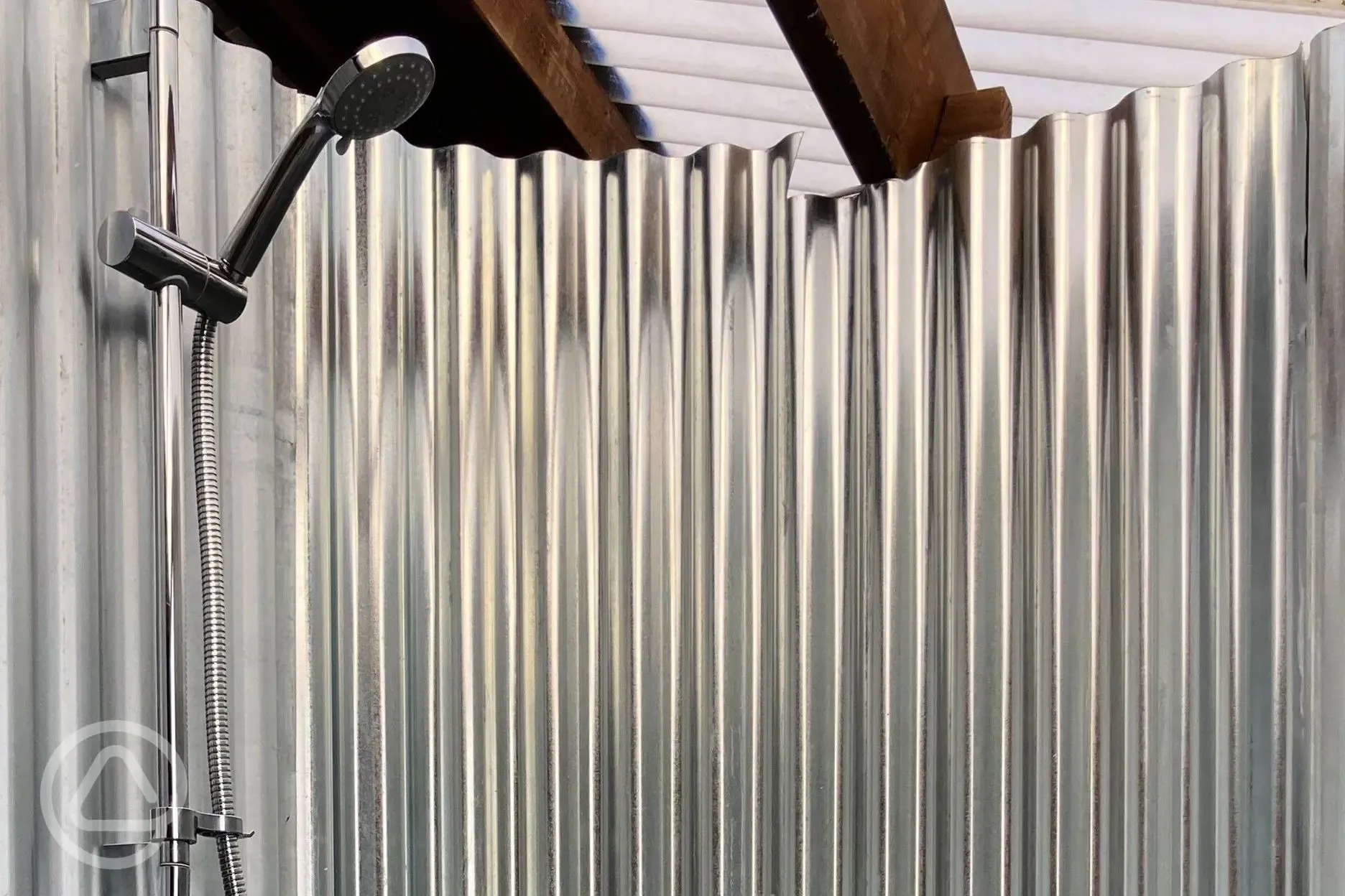 One of the four showers in the facility block