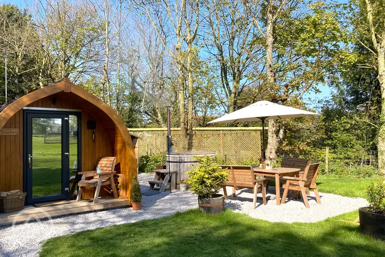 Bracken glamping pod with a barrel hot tub at The Paddock Pods at Homeland