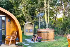 Bracken glamping pod hot tub and outdoor seating area