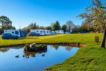 Perry Orchard touring pitches with optional 16 amp hook ups 