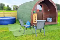 Camping pod with a private Lay-Z Spa hot tub and outdoor gas stove