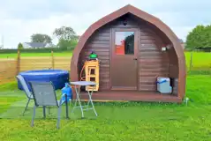 Camping pod with a private Lay-Z Spa hot tub and outdoor gas stove