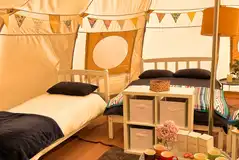 Double bed and two singles in the luna bell tents Double bed and two singles in the luna bell tents