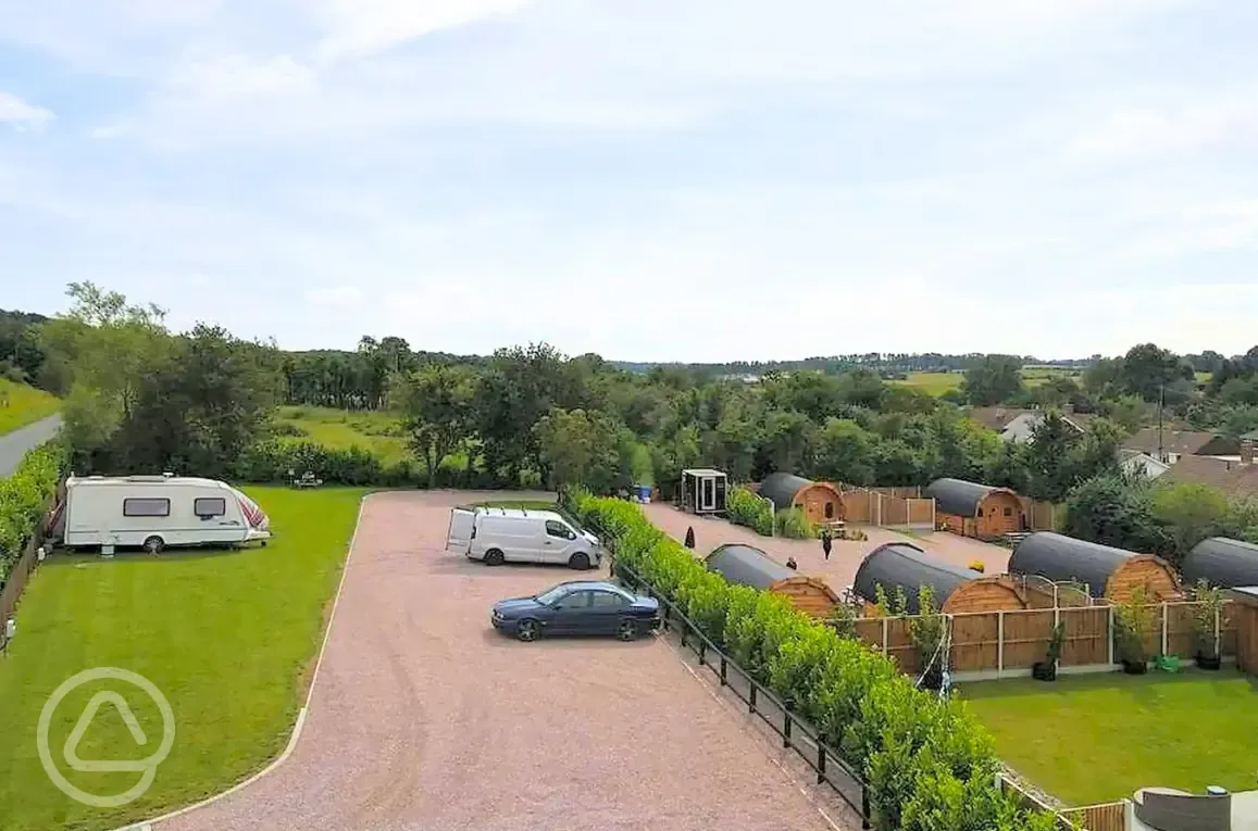 Aerial of the electric grass pitches and glamping pods