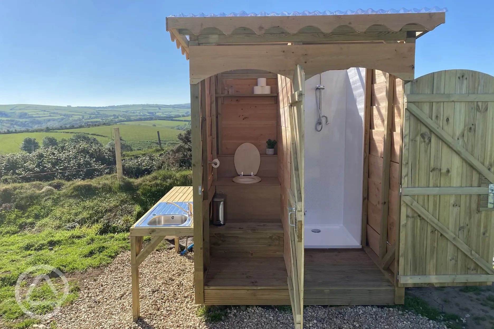 Compost loo, shower and washing up area