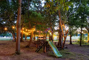 Children's play area at night lit up by lights
