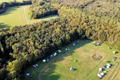 Aerial of Yamp Camp Deer Park surrounded by woodlands
