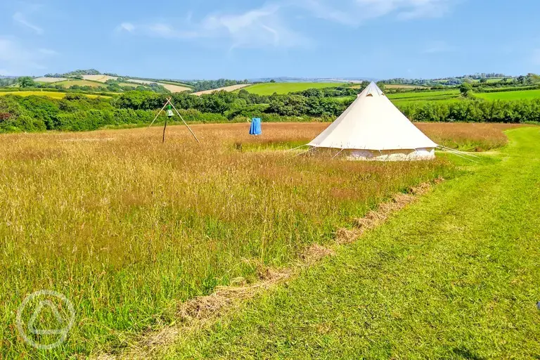 Bell tent with distant views of Dartmoor National Park at Cannamore Camping
