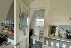 Luxury ensuite glamping pod with an outdoor hot tub ensuite