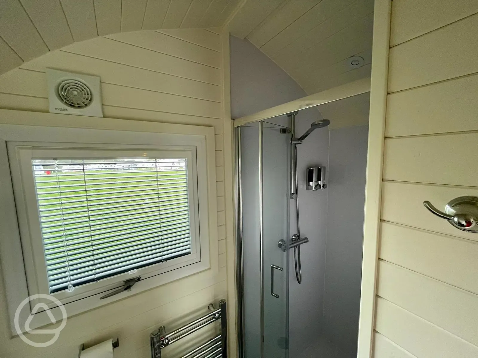Luxury ensuite glamping pod ensuite with heated towel rail and toiletries