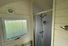 Luxury ensuite glamping pod ensuite with heated towel rail and toiletries