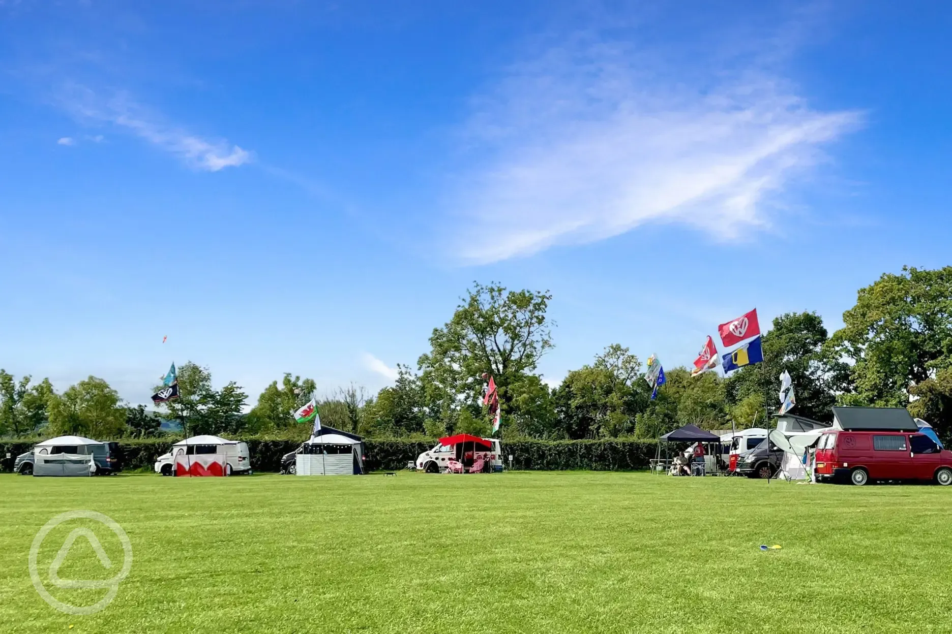 Electric grass touring pitches at Abbey Farm Caravan and Glamping