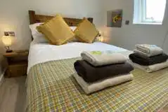 Eight person (Severn) pod double bedroom with bedding