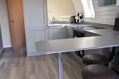 Usk glamping pod kitchen with a breakfast bar